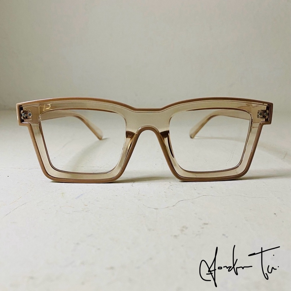Tan Rectangular Glasses With Bold Design - image 1
